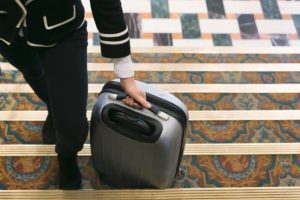 Rolling suitcase into hotel